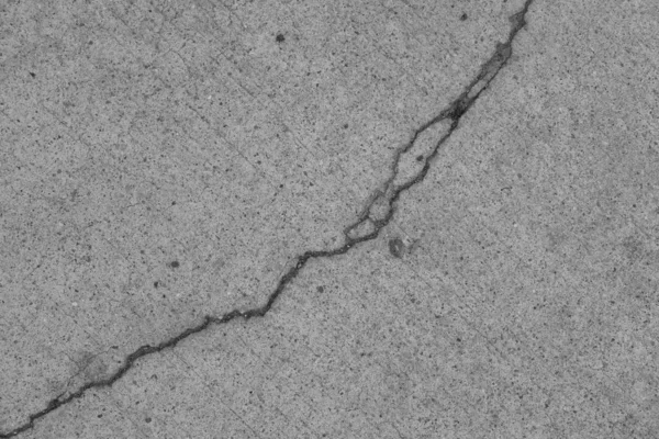 Crack in concrete on the streets of Los Angeles. Background for interior design.