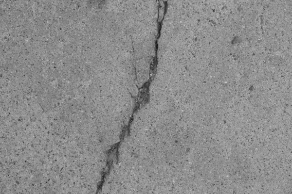 Crack in concrete on the streets of Los Angeles. Background for interior design.