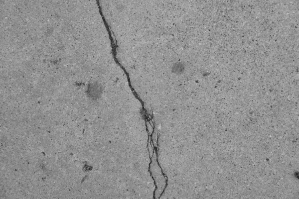 Crack in concrete on the streets of Los Angeles. Background for interior design.