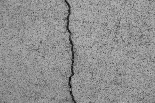 Crack in concrete on the streets of Los Angeles. Background for interior design.