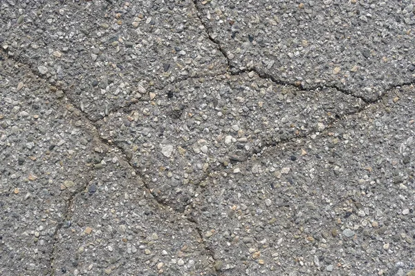 Crack in concrete on the streets of Los Angeles. Background for interior design.