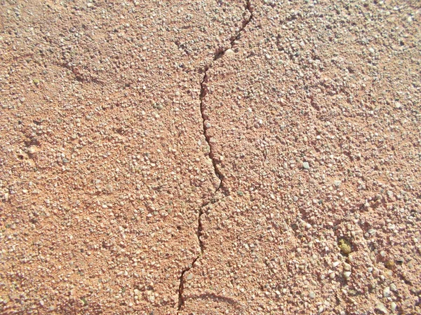 Crack in concrete on the streets of Los Angeles. Background for interior design.