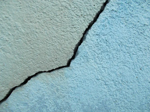 Crack in concrete on the streets of Los Angeles. Background for interior design.