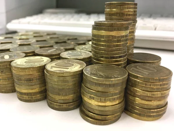 Russian ten ruble coins on light background.