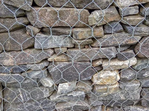 Fondo de piedra gris natural apretado con malla — Foto de Stock