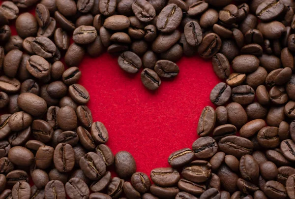 Creative concept photo of heart made of coffee on isolated background — Stock Photo, Image