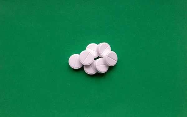 Pill isolated on green background with clipping path — Stock Photo, Image