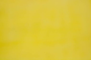 Sarı boyalı duvar. Parlak sarı arkaplan duvar kağıdı..