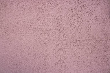 Pembe dekoratif rahatlama. Pembe sıva duvar. Duvarın pembe arkaplanı.