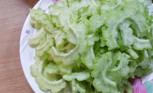 SLICE RAW BITTER GOURD.Cutting bitter gourd.vegetables, herbs, ingredient of food.