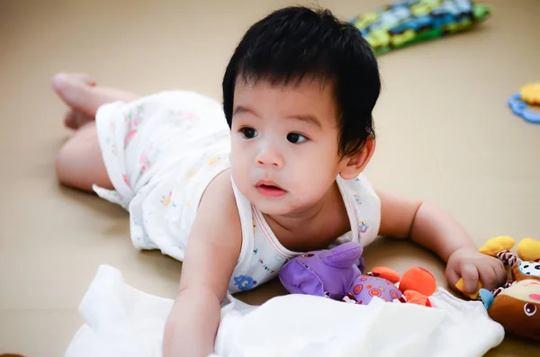 baby on bed with toy,kid smile