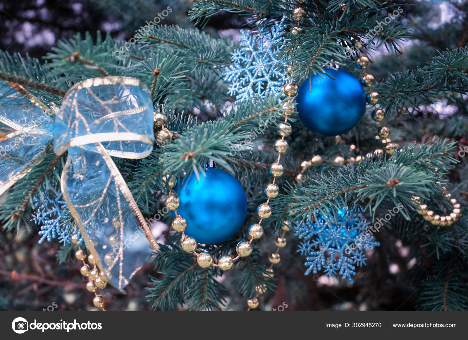 Closeup of Christmas tree branches with snowflakes - a Royalty