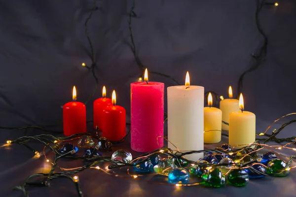 Thin Wax Candle Small Lit Flame Background Candles Old Table Royalty Free Stock Images
