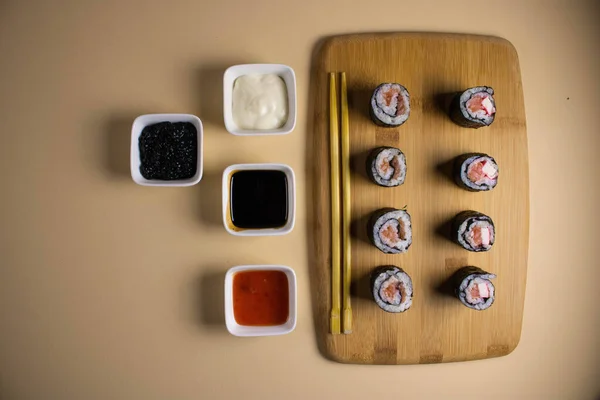 Set Sushi Rolls Served Light Background Delicious Traditional Japanese Food — Stock Photo, Image