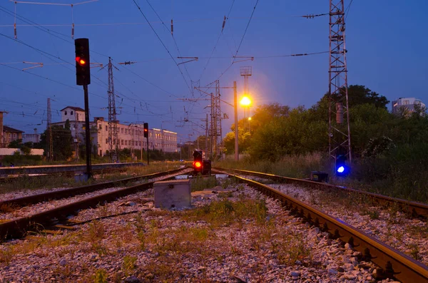 Railway signal with blue light with railroad junction