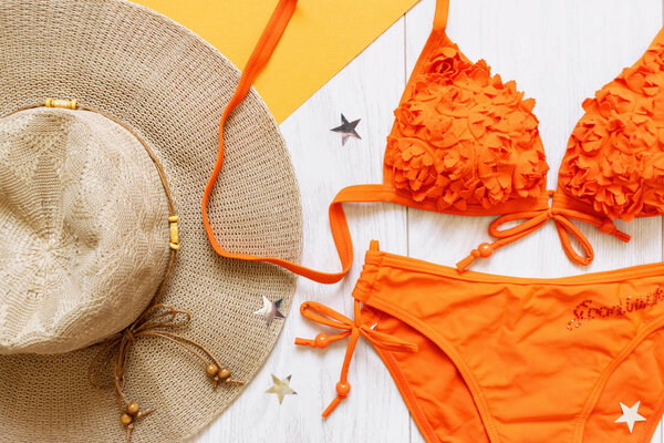 summer flat lay with swimsuit and hat