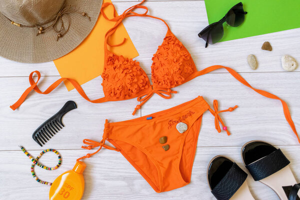 summer flat lay with swimsuit and accessories