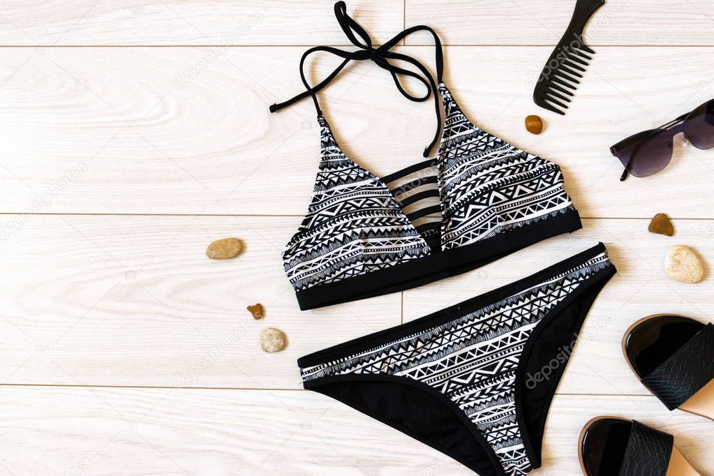 summer flat lay with swimsuit and place for text