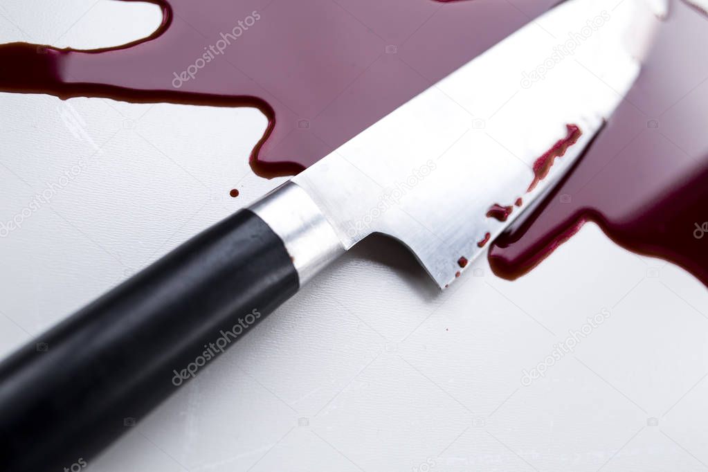 Blood stain and knife. Crime.