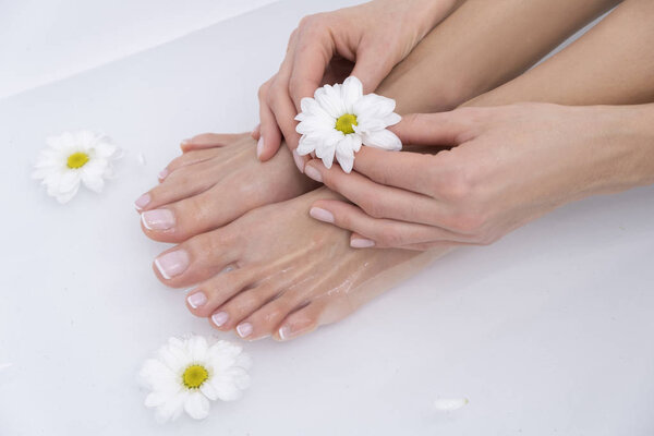 Beautiful female legs and feet in the bath.