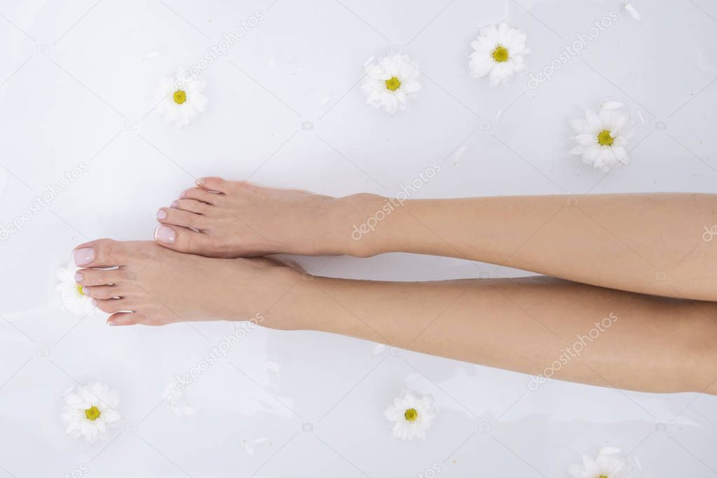 Beautiful female legs and feet in the bath.