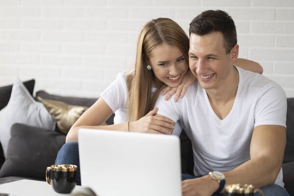 Young couple surfing at the internet.