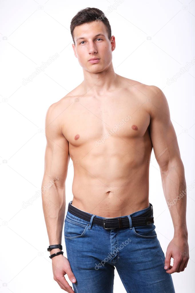 Studio shoot of young sport man shirtless.
