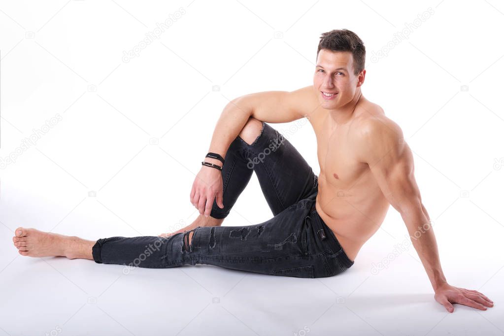 Nice, young adult man posing in a studio.