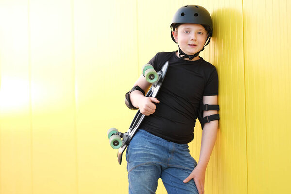 Young boy with skateboard.