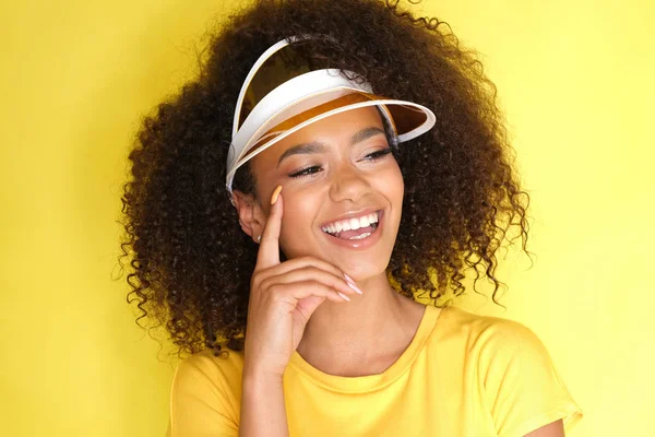 Happy afro-amercian girl is cheerful and smiling.