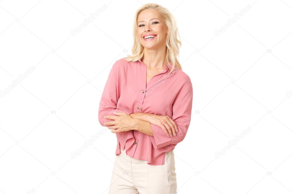 Intelligent woman in pink shirt isolated on white background is smiling to the camera.