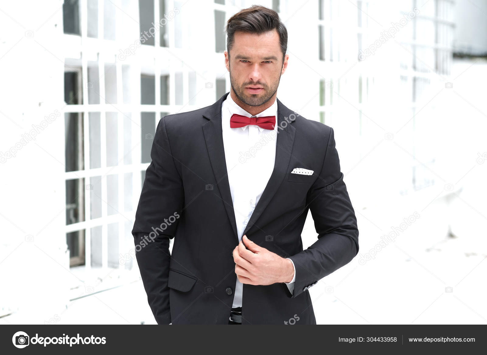 all black suit and bow tie