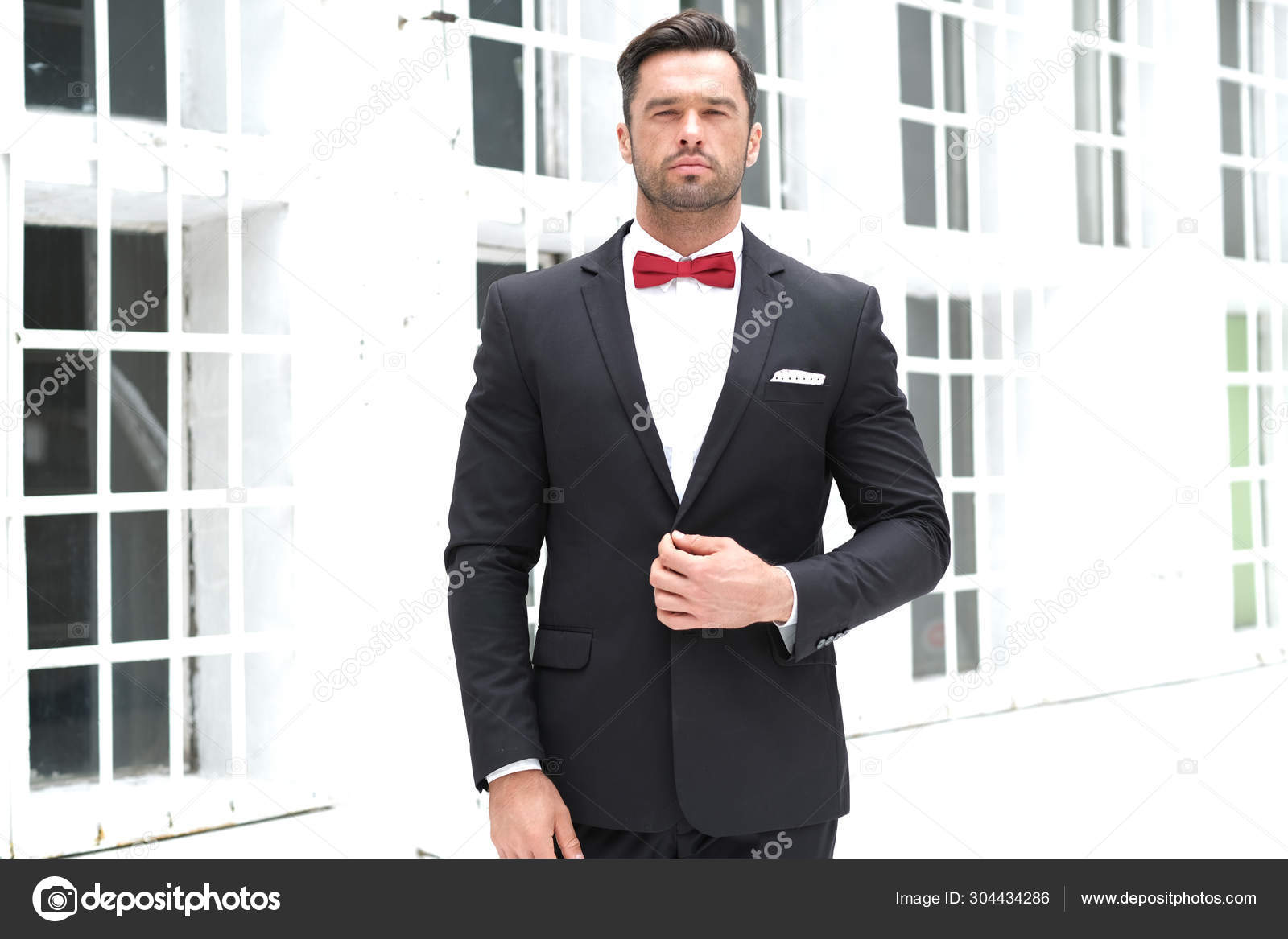 all black suit and bow tie