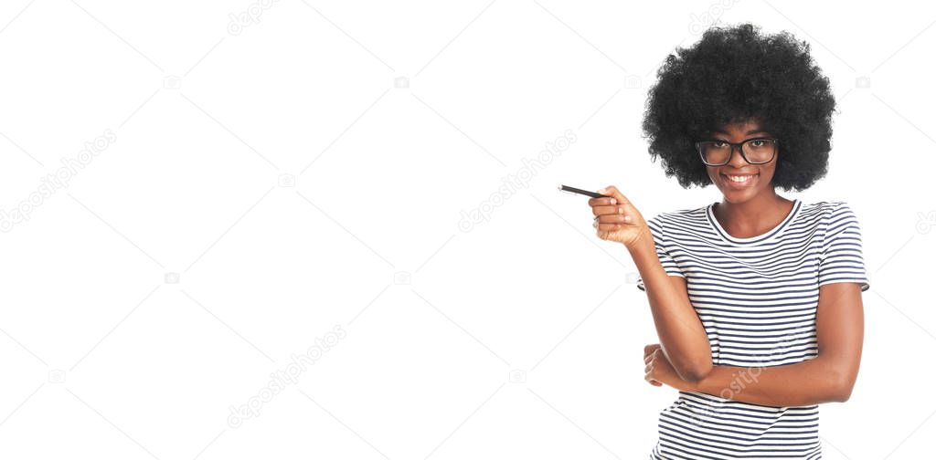 Happy afro woman with a pen isolated on white background.