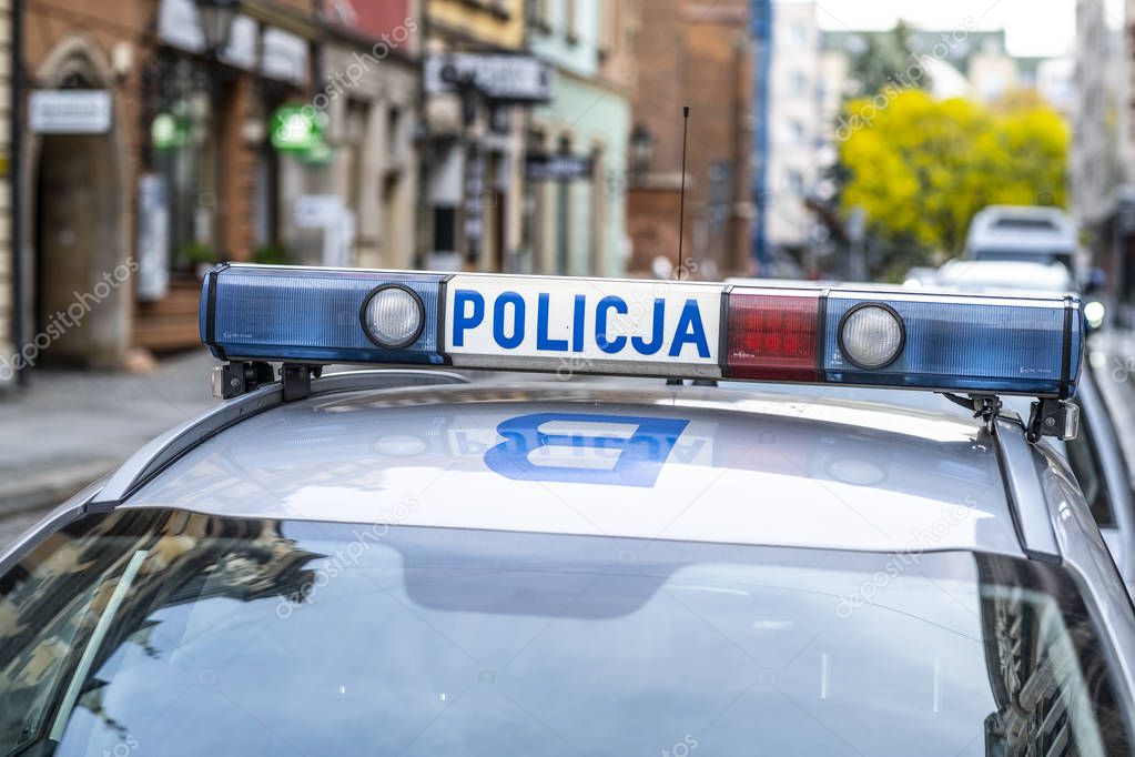 The logo of municipal police on police car.