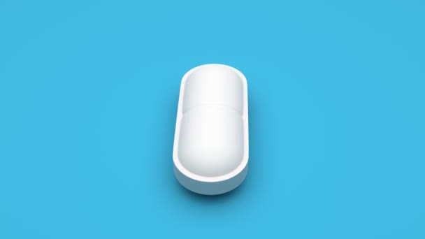 Bílé Pilulky Izolované Rotující Modrém Pozadí Bezproblémová Smyčka Uhd Vykreslování — Stock video