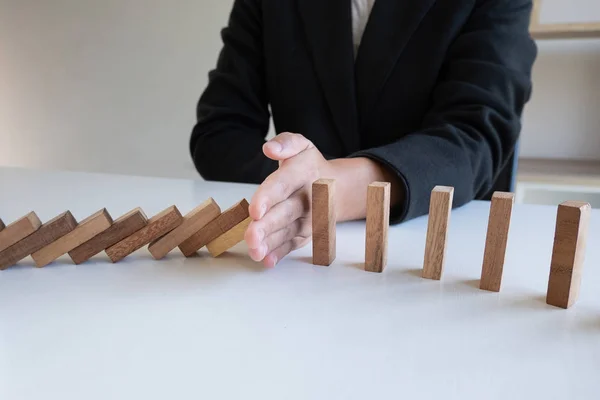 hand stop blocks wood game, gambling placing wooden block. Concept Risk of management and strategy plan, protect business to success