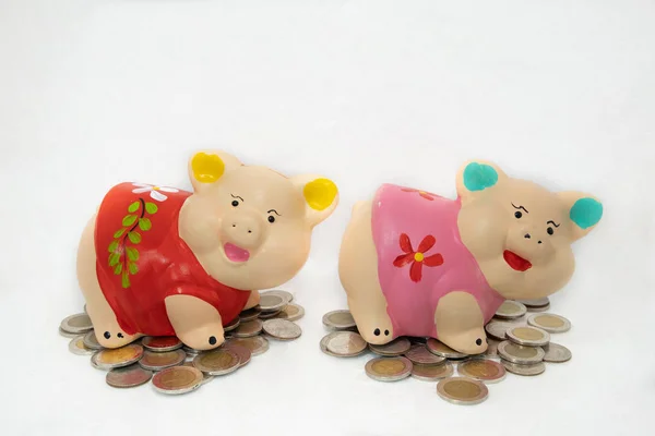 Red and Pink piggy bank saving money and coins pile — Stock Photo, Image