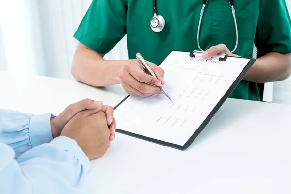 Male doctors explain and recommend treatment after a female patient meets a doctor and receives results regarding illness problems. Medical and health care concepts.