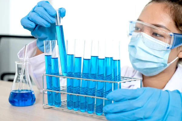 Medical scientists have experimented with liquid chemicals in vitro to analyze viral data in chemical laboratories. Scientific research concepts.