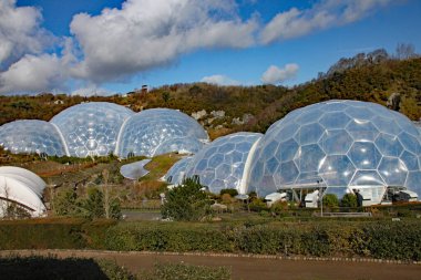 The biomes at the Eden Project in Cornwall, England. Opened in 200 and was built on a disused china clay pit and contains plants from a wide diversity of climates and environments clipart