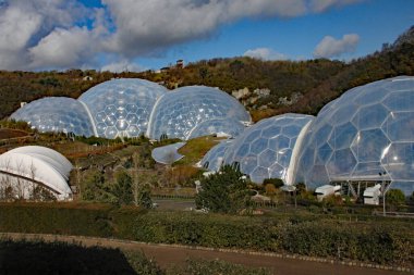 The biomes at the Eden Project in Cornwall, England. Opened in 200 and was built on a disused china clay pit and contains plants from a wide diversity of climates and environments clipart