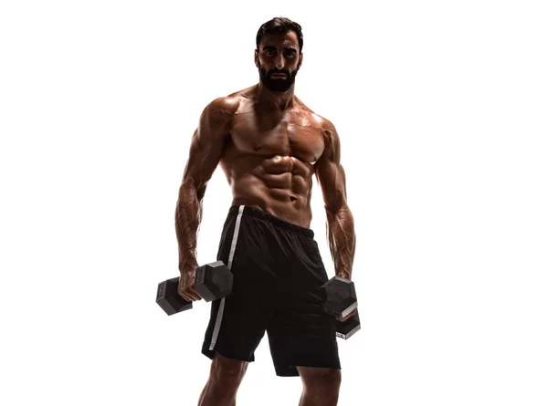 強いハンサムな筋肉の男性は重量を持ち上げ、ダンベを実行します — ストック写真