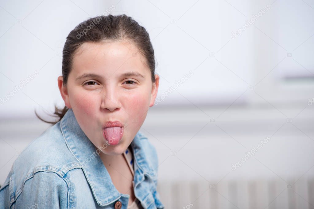 a pretty girl pulling out the tongue
