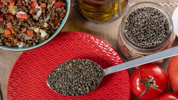 Green Lentils Spoon Red Plate — Stock Photo, Image