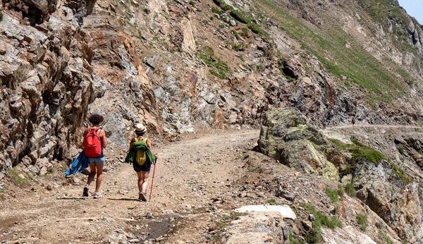 two women hikers on the trail of the Pic du Midi de Bigorre in the Pyrenees