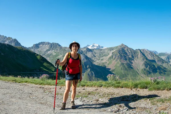 a woman hiker on the trail of  Pic du Midi de Bigorre in the Pyrenees