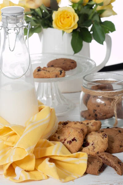 cookies on the white wooden table with a yellow towel