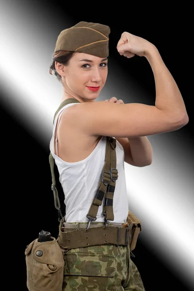Young woman dressed in U.S wwii military uniform show her biceps — Stock Photo, Image