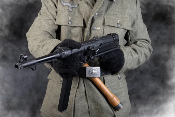 Belt and machine gun of the German soldier in jacket the second — Stock Photo, Image